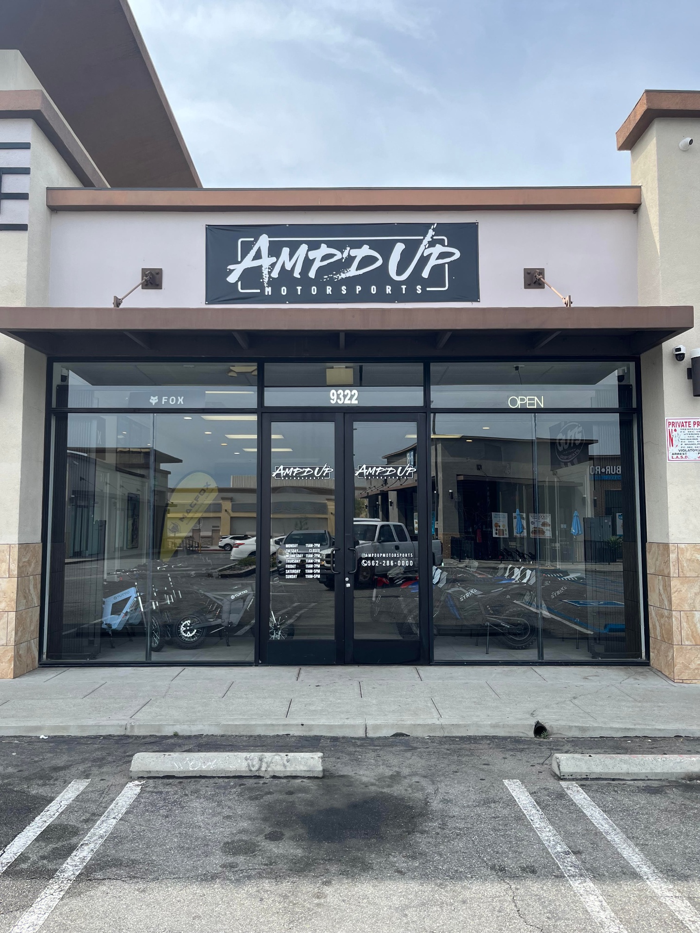 Amp'd Up Motorsports showroom lineup of electric dirt bikes